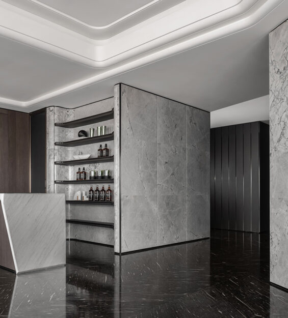 Luxury built in bar with touches of marble & dark wall panel contrasting each other.
